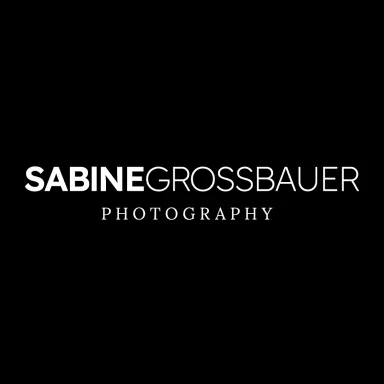 Sabine Grossbauer Photography logo on a black background.